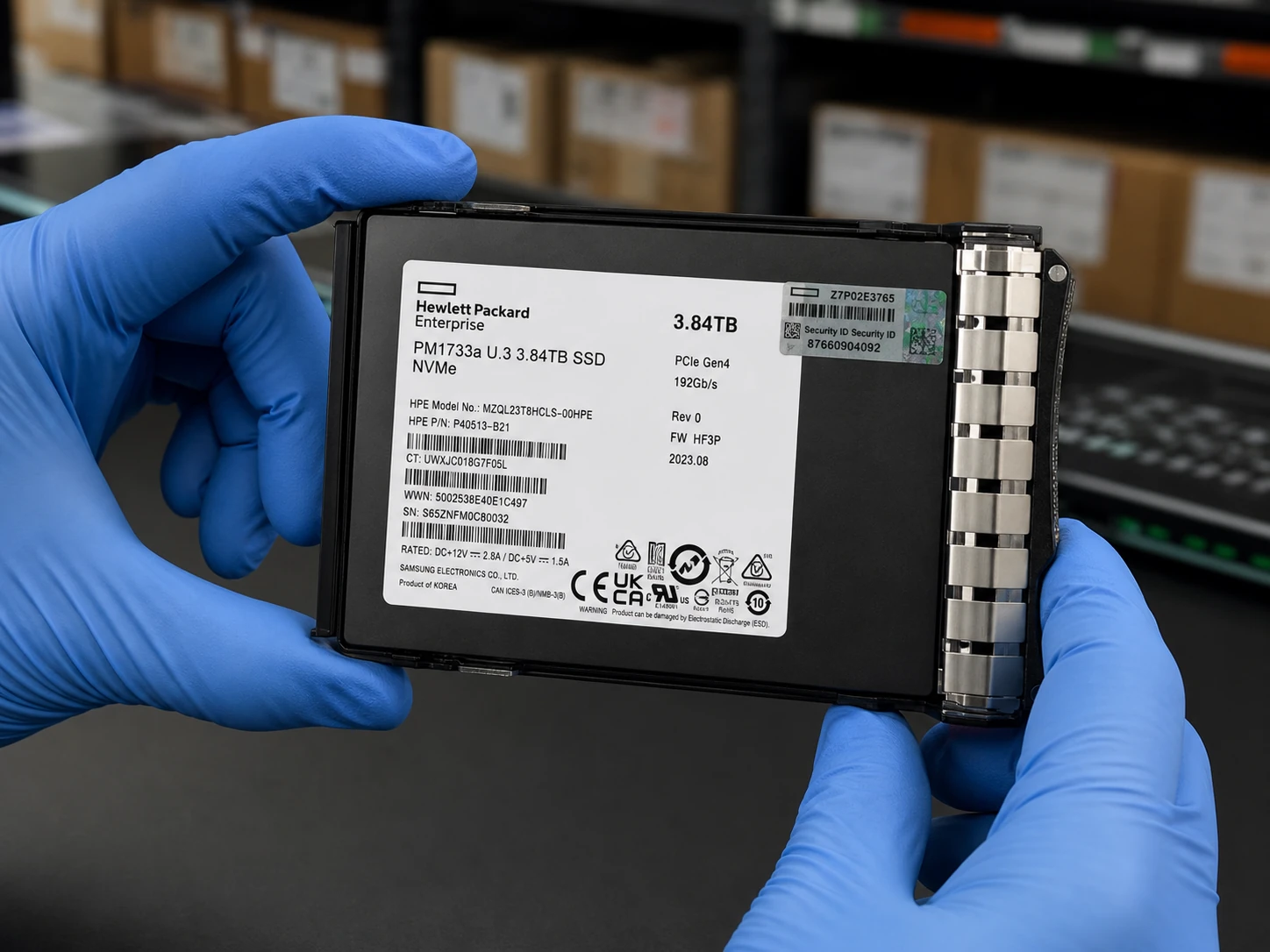 HPE enterprise SSD inspected with label visible in warehouse service environment Shown in a typical installation and handling setting.