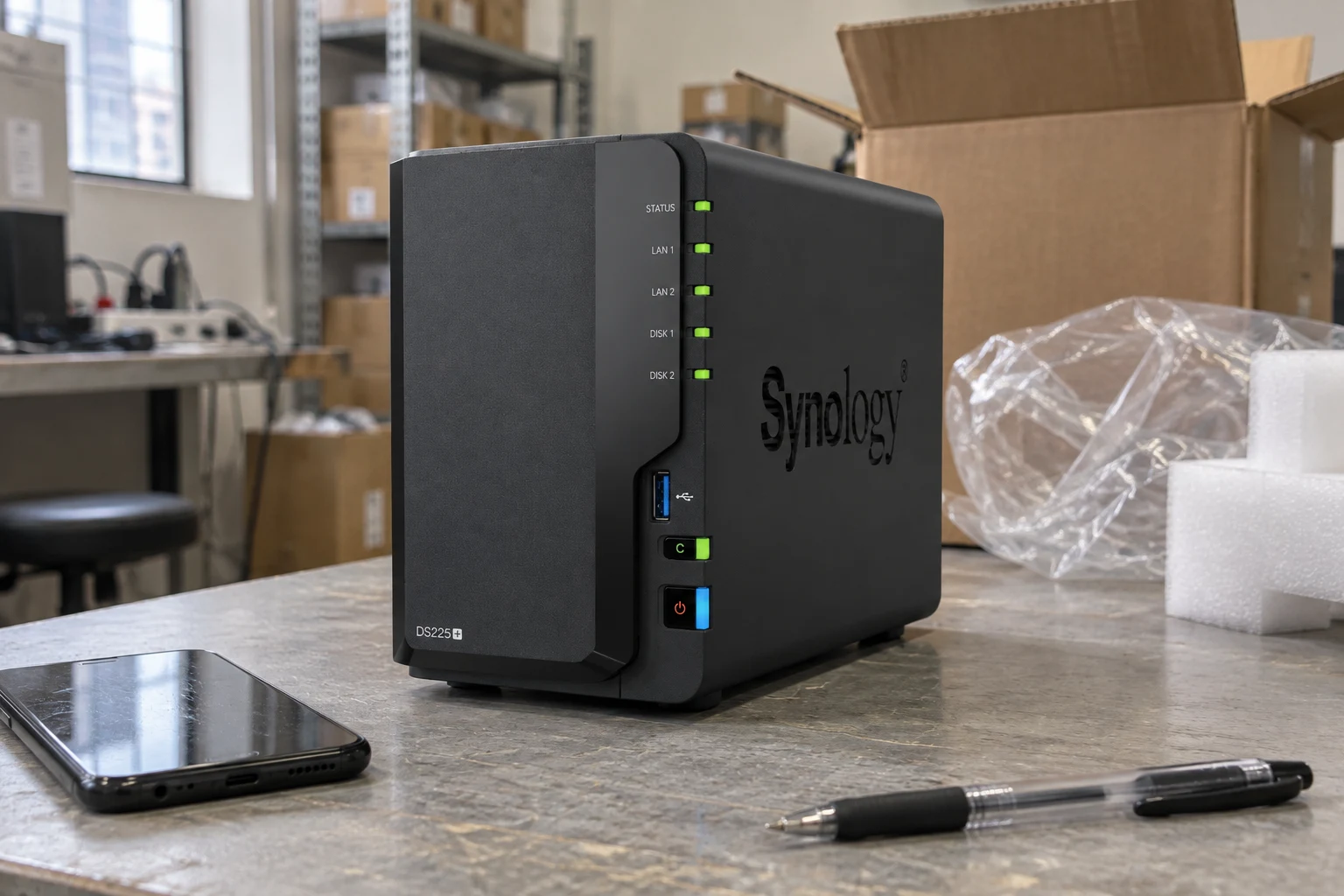 DS225+ chassis & packaging in a warehouse-style product scene